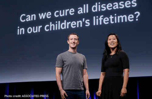 Mark Zuckerberg and Priscilla Chan stand on stage