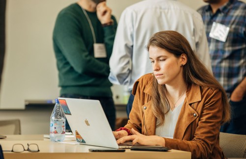 Shannon Axelord, Senior Software Engineer at the Chan Zuckerberg Initiative looks at a Imaging data on her laptop.