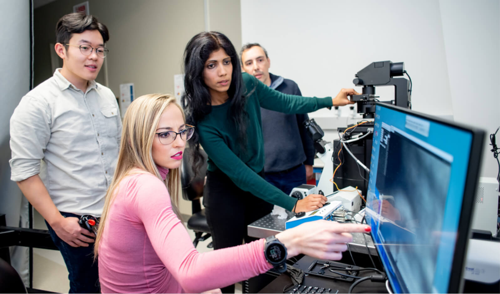 Science researchers collaborating on projects using latest technology at CZ Biohub Network