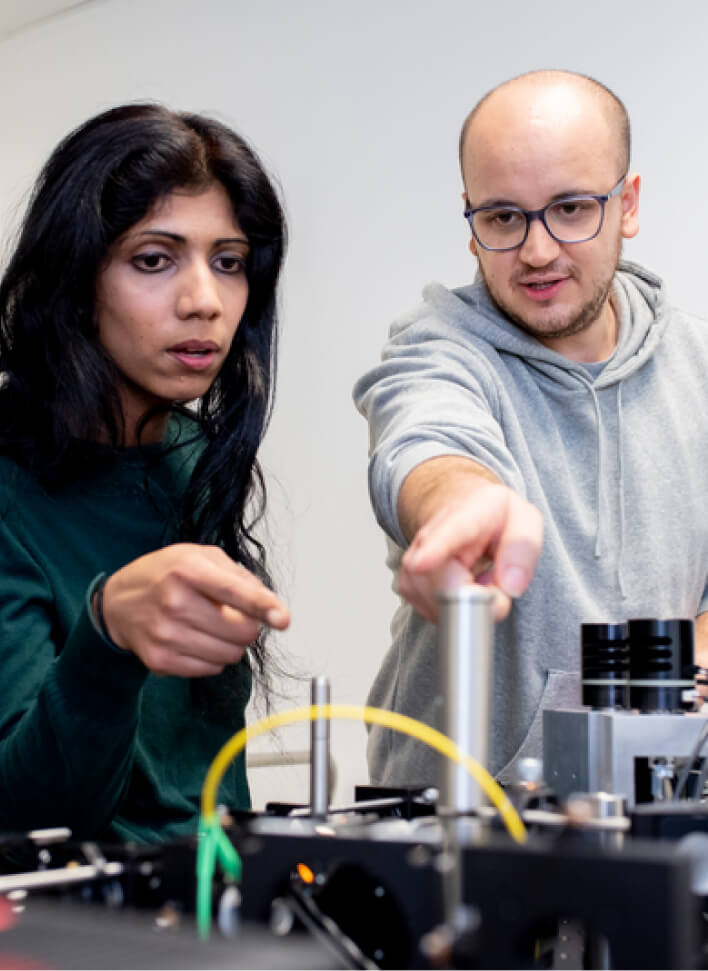 Science researchers working with lab equipment at CZ Biohub Network