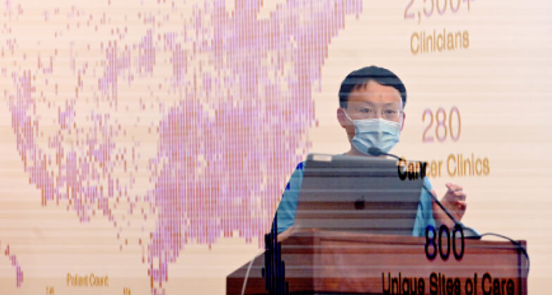 Science researcher wearing a mask and giving a speech