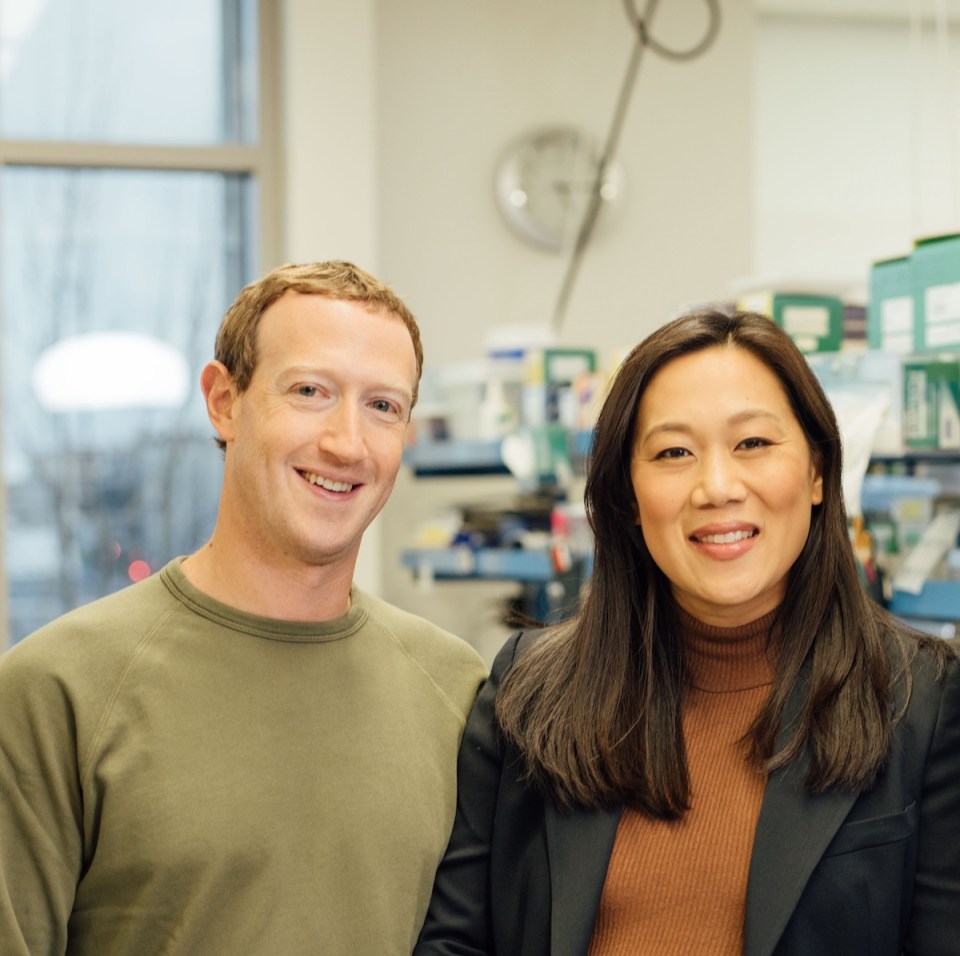 Mark Zuckerberg and Priscilla Chan of the Chan Zuckerberg Initiative with a science research lab in the background