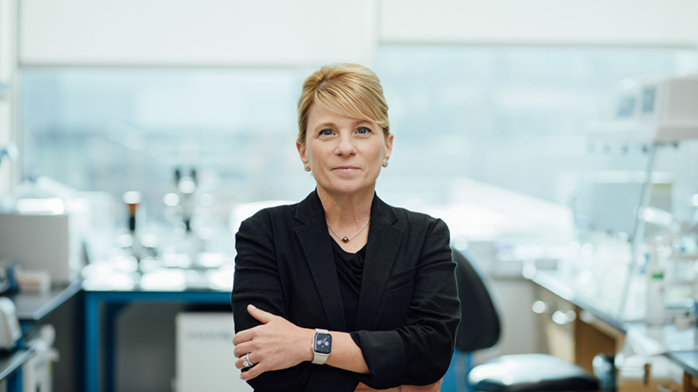 Shana Kelley, President of the CZ Biohub Chicago stands in a research lab.