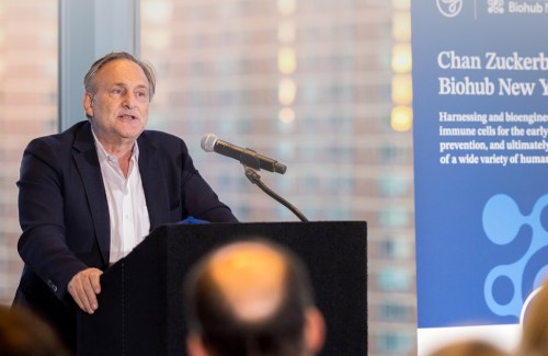 Andrea Califano, president of CZ Biohub NY stands at a podium.