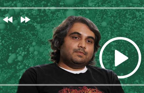 Imaging scientist Gokul Upadhyayula headshot on green background.